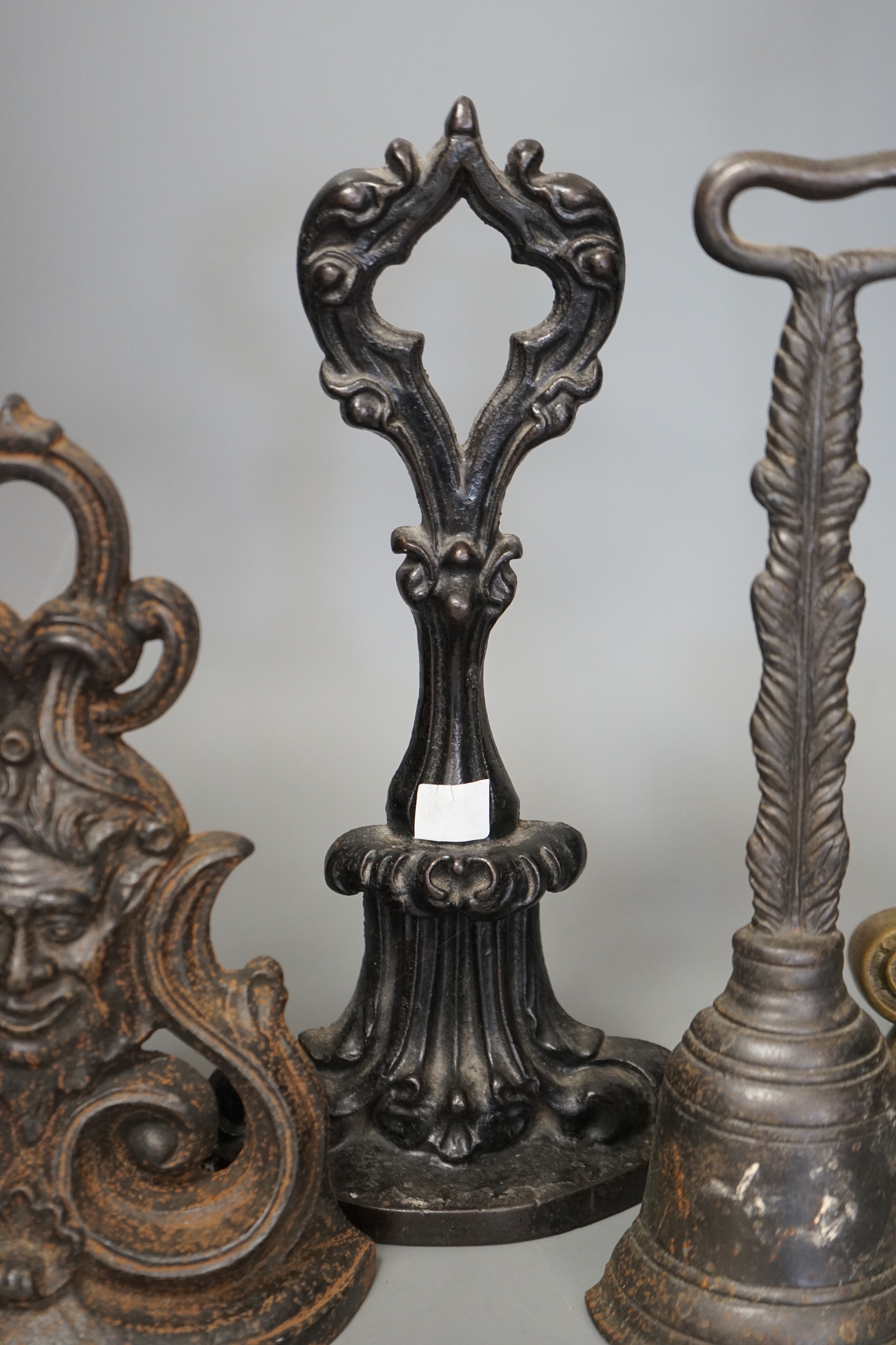 Four cast iron Victorian assorted door stops, tallest 38cm